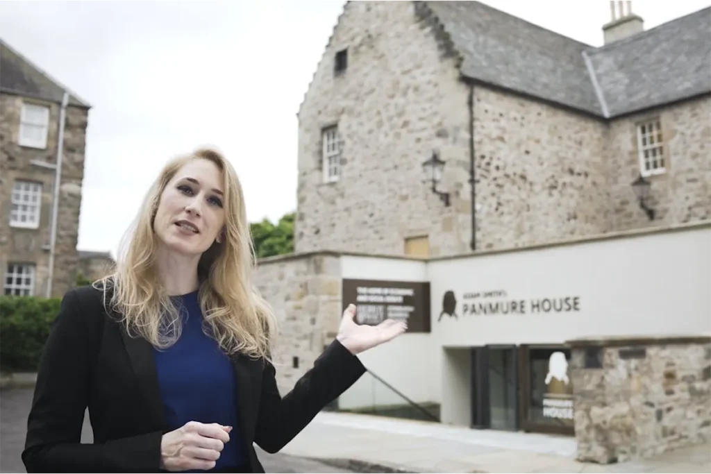 Caroline Howitt, Programme Director at Adam Smith's Panmure House, stands in front of Panmure House.